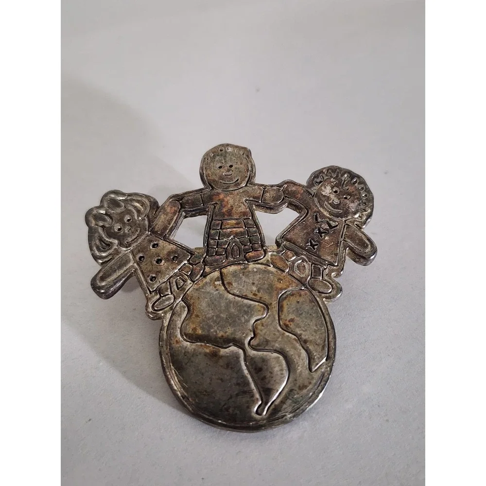 Vintage Silver Tone Children Holding Hands World Globe Brooch Pendant MJ Logo